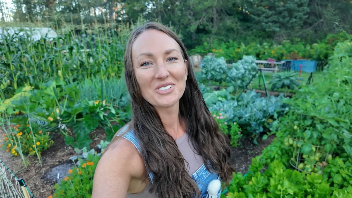 A woman in a garden.