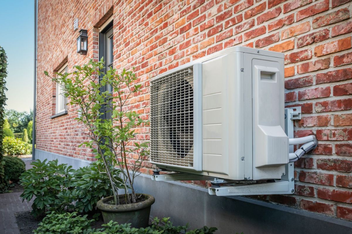 A heat pump alongside a home.