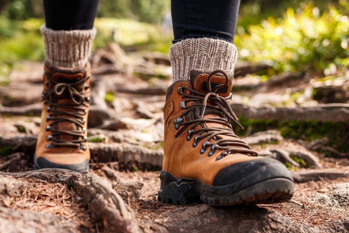 A hiker walking on a trail.