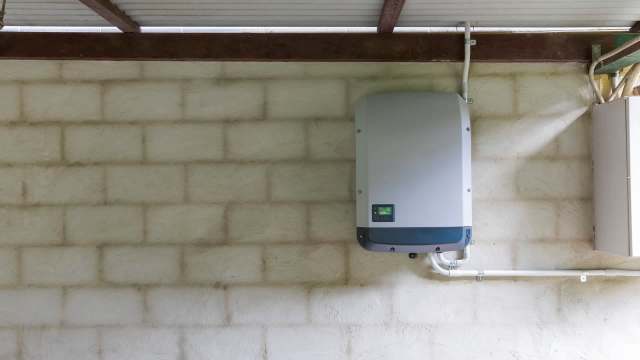 A solar inverter on a wall.
