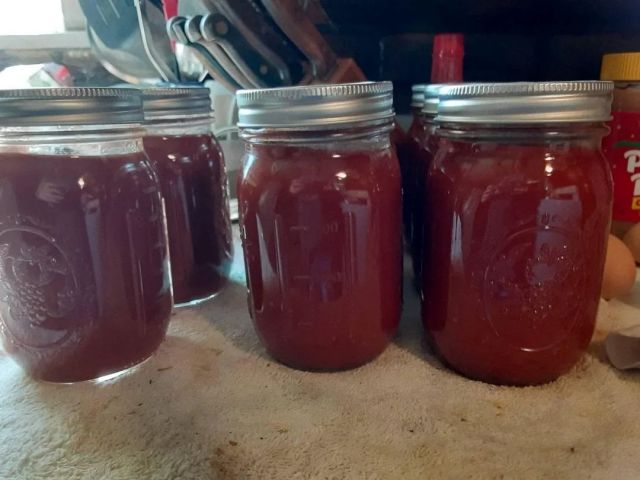 Mason jars of homemade ketchup.