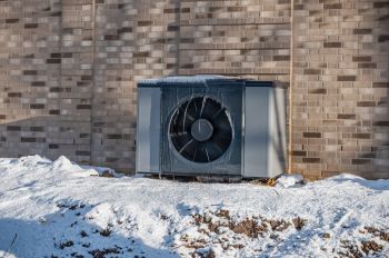 A heat pump in the snow.