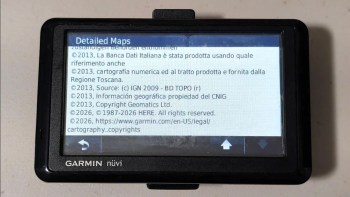 A Garmin GPS device displaying detailed maps and copyright information.