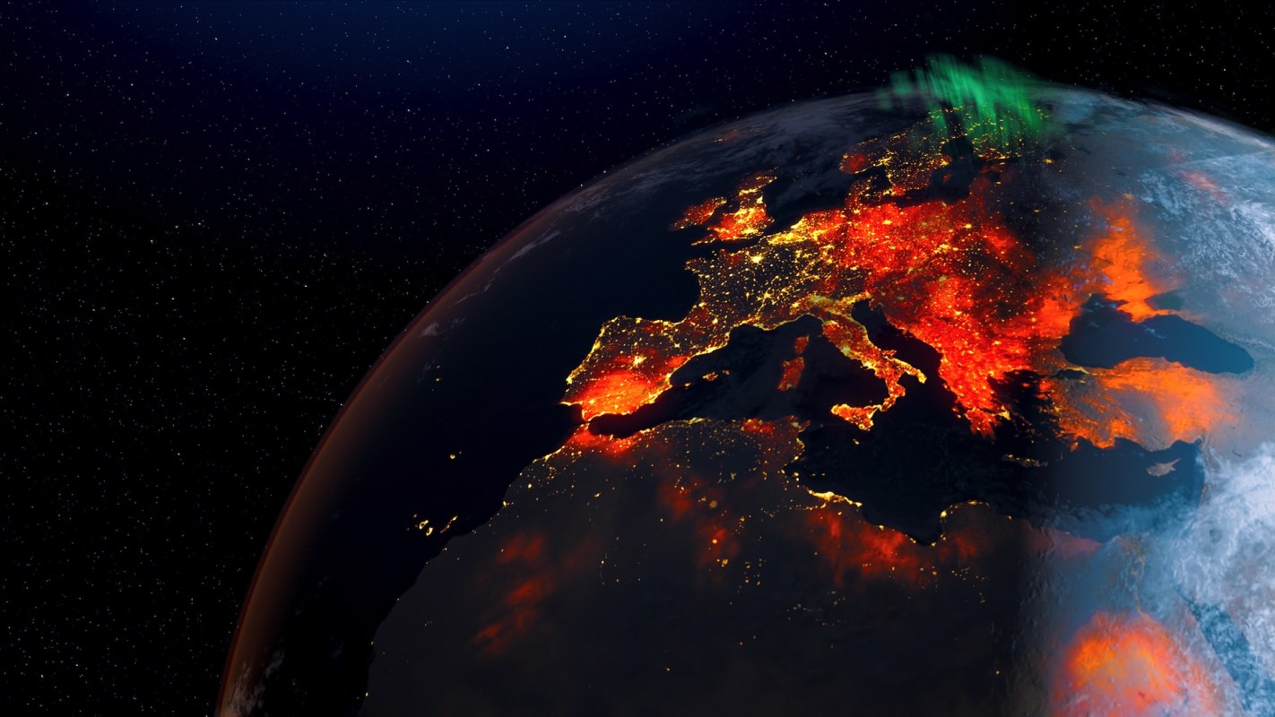 A view of Earth from space, highlighting illuminated areas of Europe against a starry background.