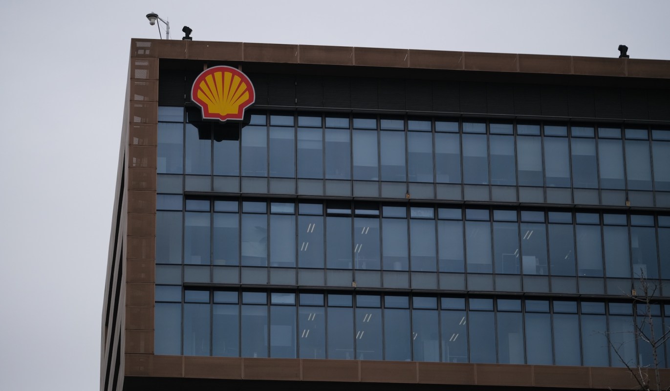 A building with a Shell logo and large glass windows.