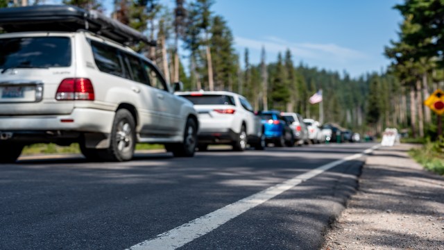 A line of vehicles entering a national park.