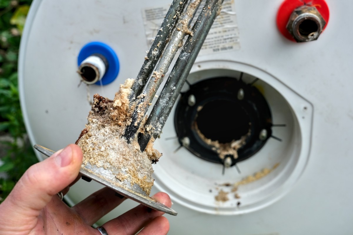 A corroded water heater part.