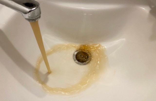 Brown water from a tap.