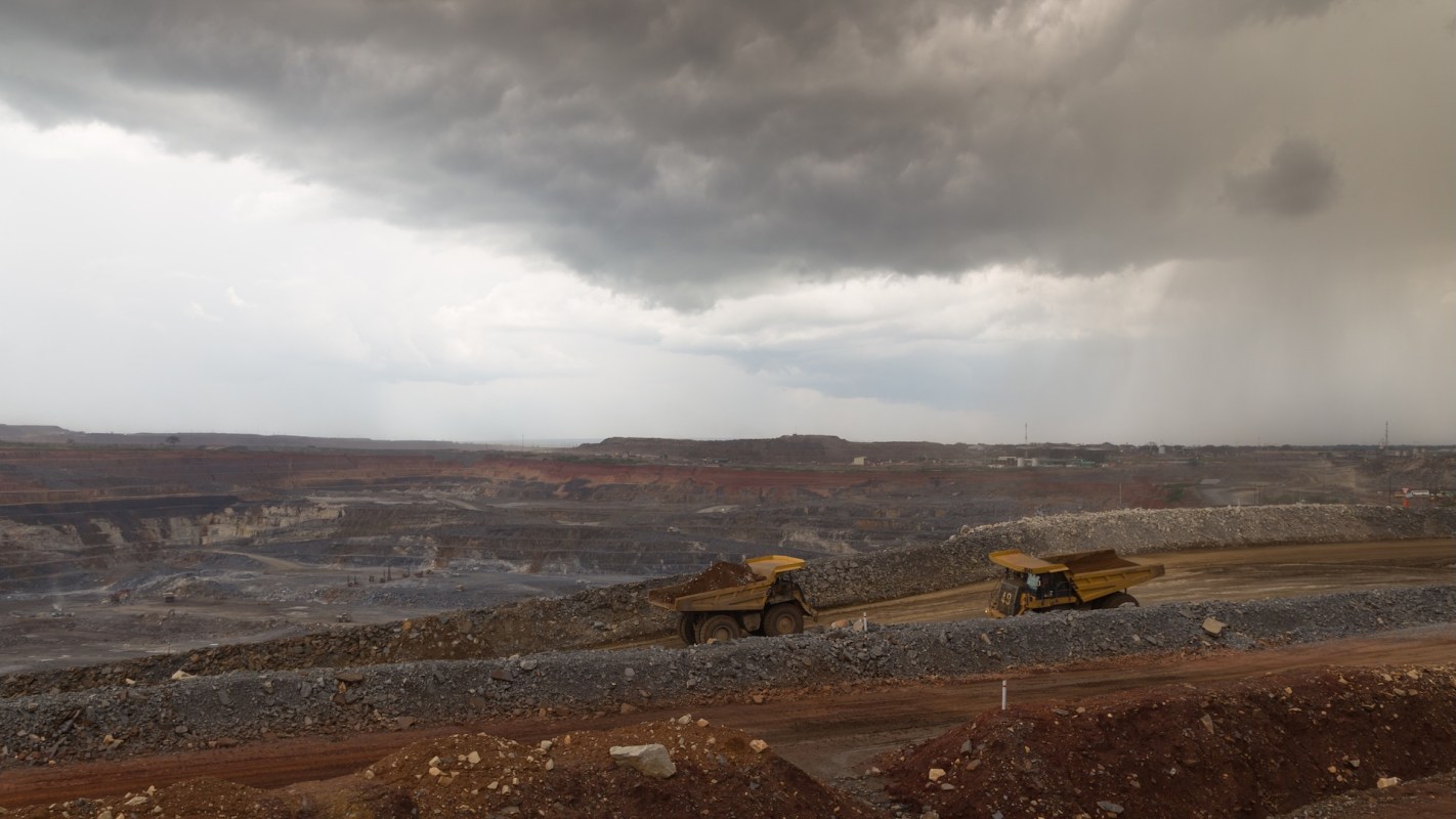 Dump trucks at a copper mine.
