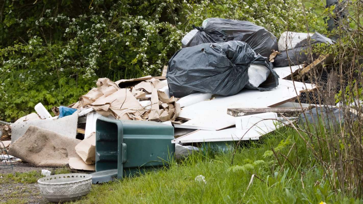 A pile of garbage in the countryside.