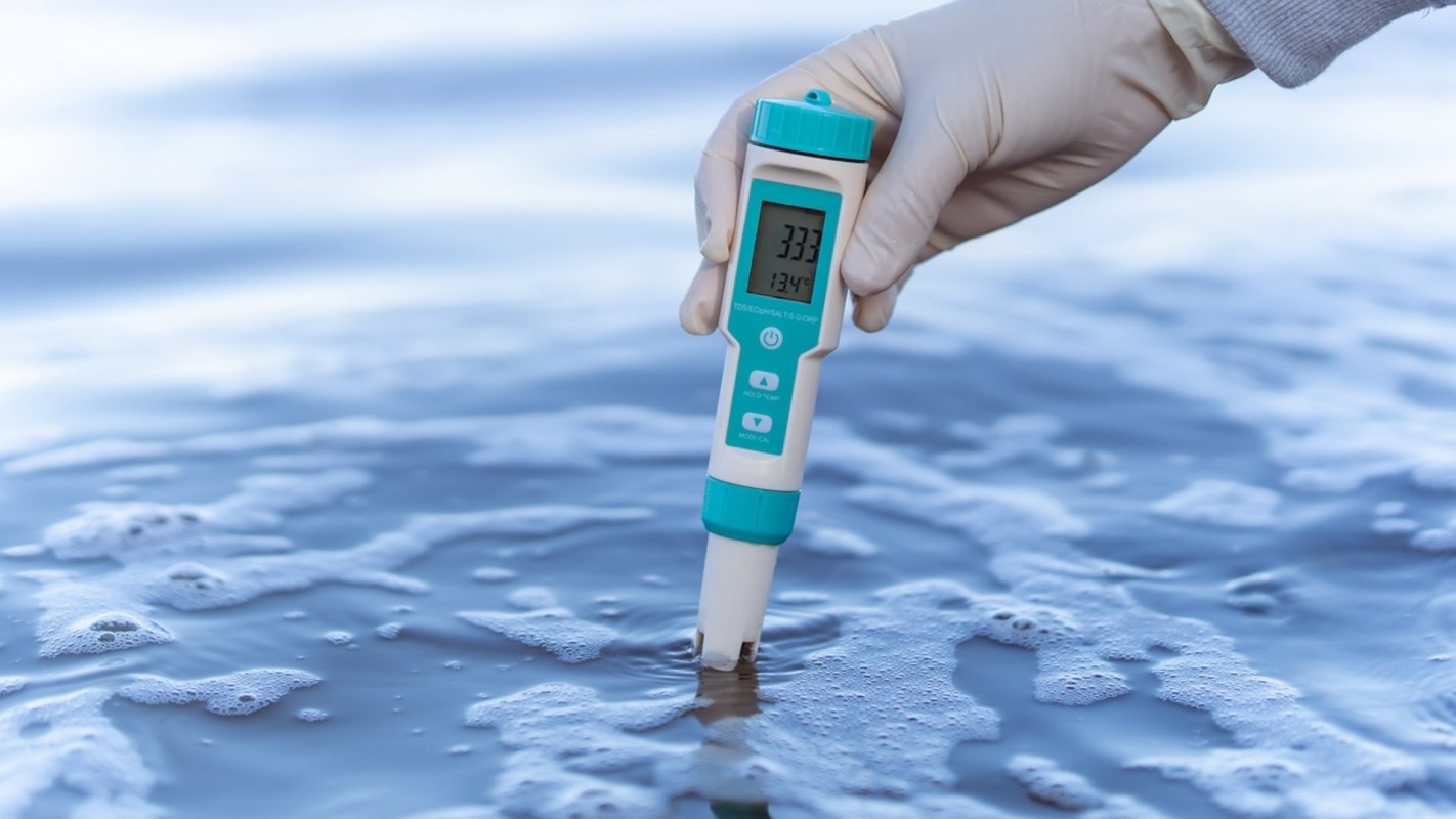 A person testing water.