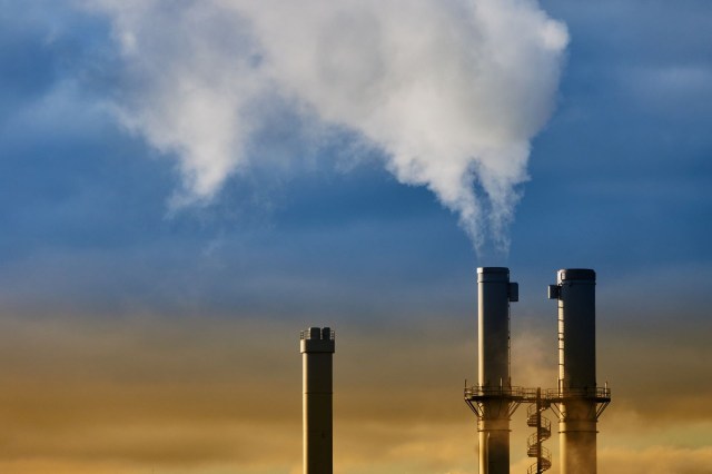 Smoke coming out of an incinerator tower.