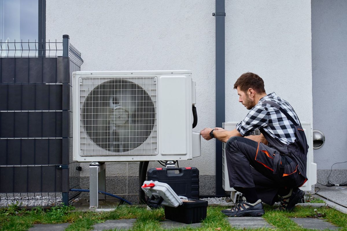 A technician installing a heat pump.