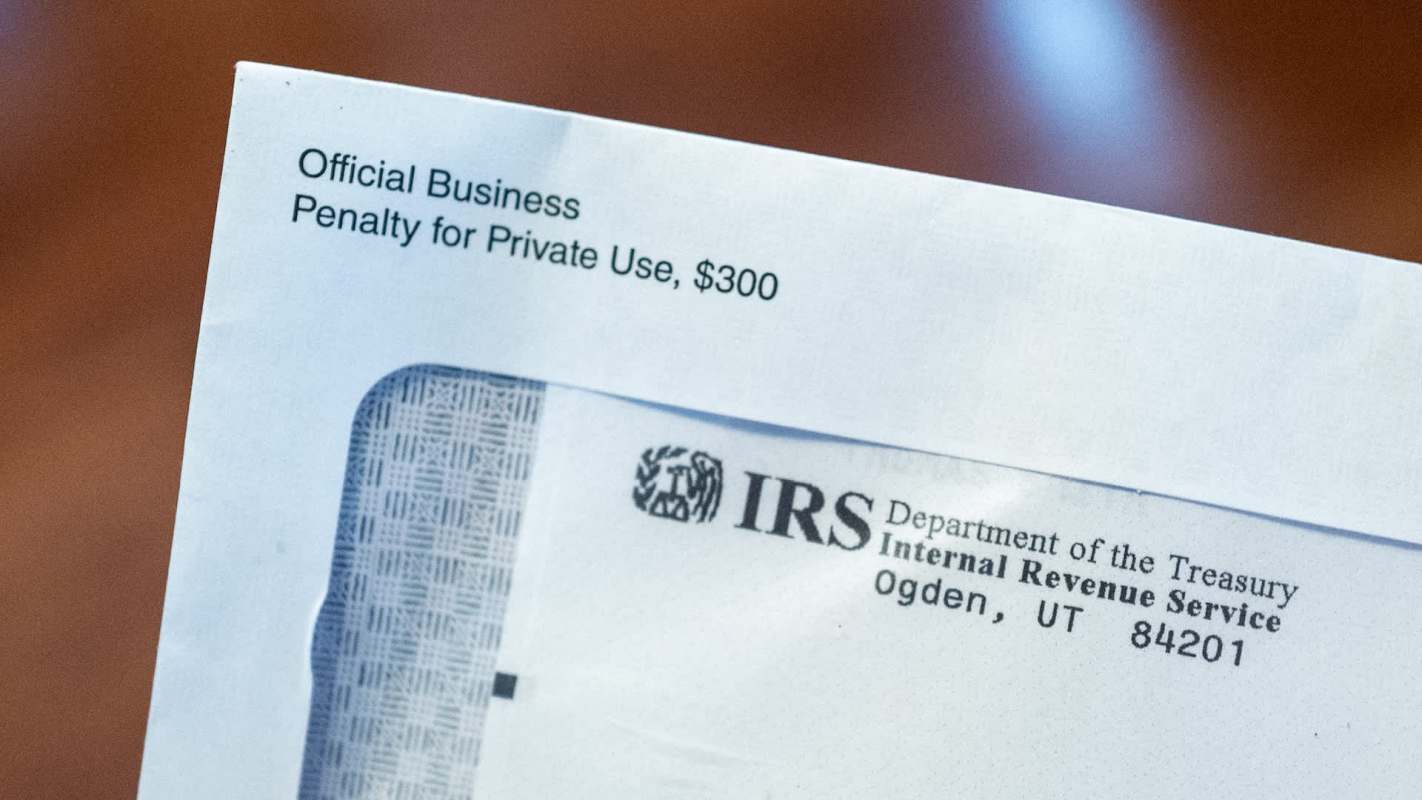 An envelope labeled "Official Business" from the IRS with a warning about penalties for private use.