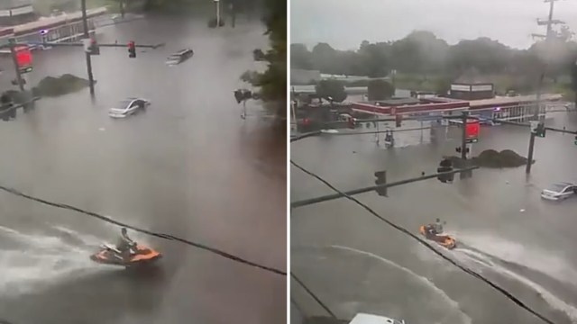 A jet ski navigating through flooded roads.