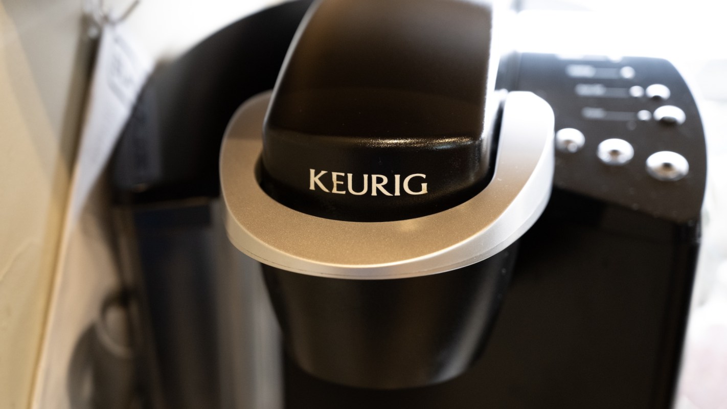A Keurig coffee maker with a single-serve pod holder.