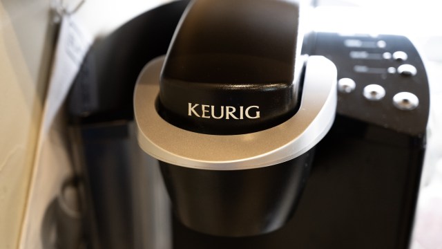 A Keurig coffee maker with a single-serve pod holder.