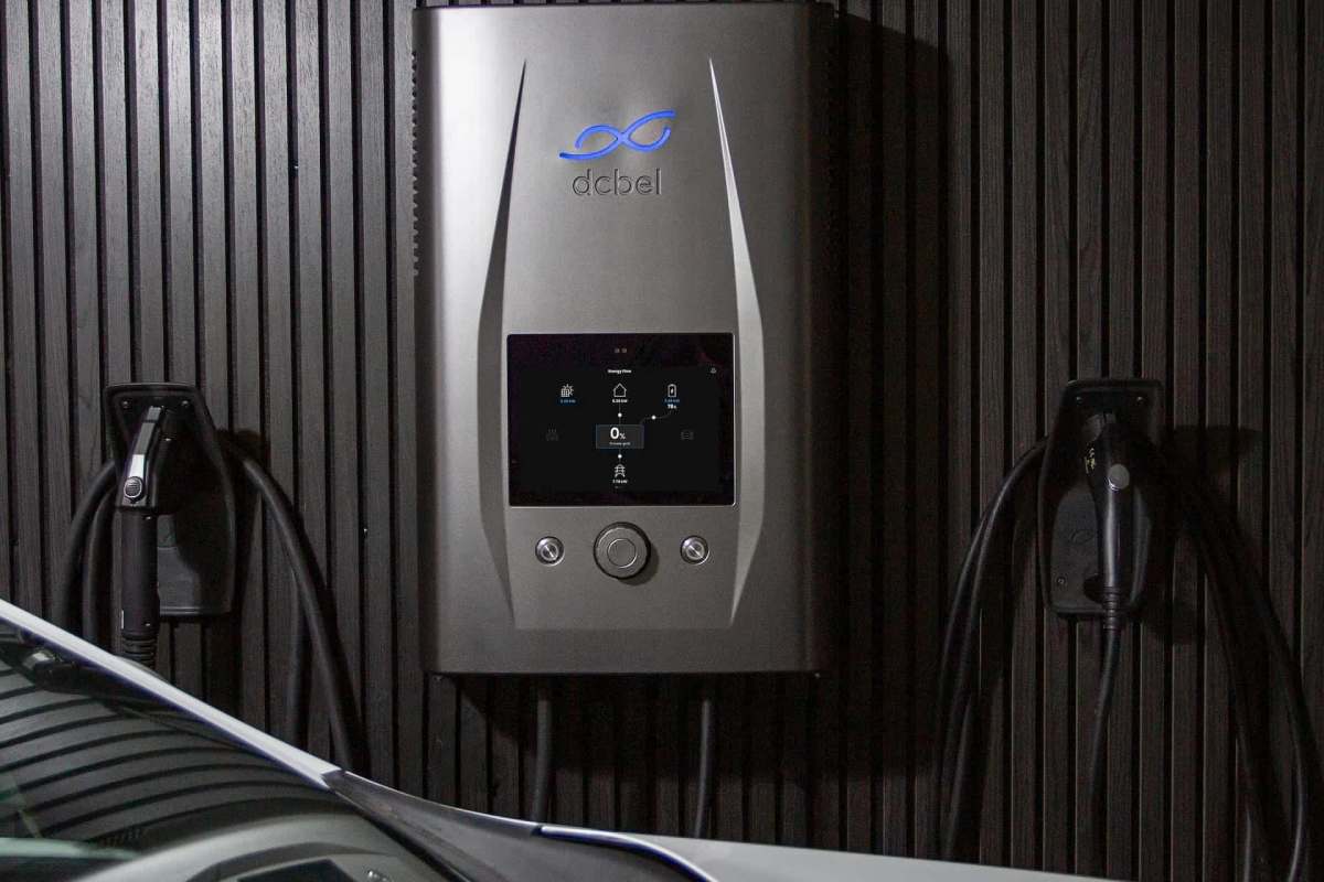 An electric vehicle charger on a wall.