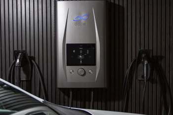 An electric vehicle charger on a wall.