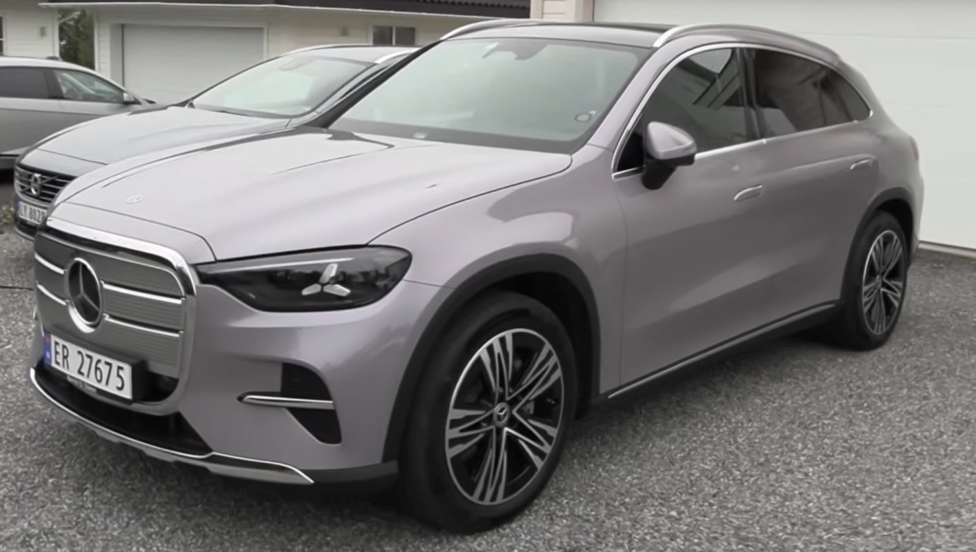 A silver Mercedes-Benz SUV parked on a gravel driveway.