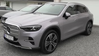 A silver Mercedes-Benz SUV parked on a gravel driveway.