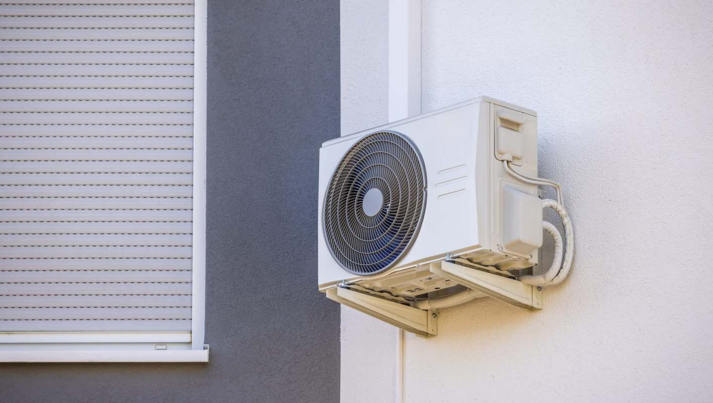 An AC unit mounted on a wall.