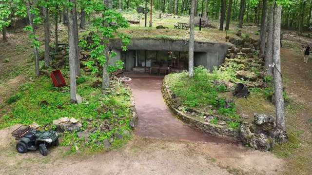 A cave house in the woods.