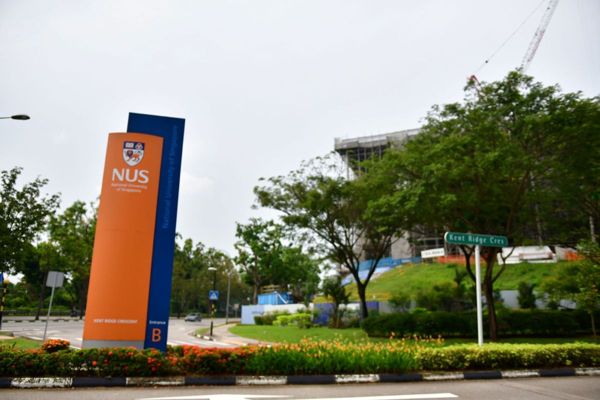 A National University of Singapore sign.