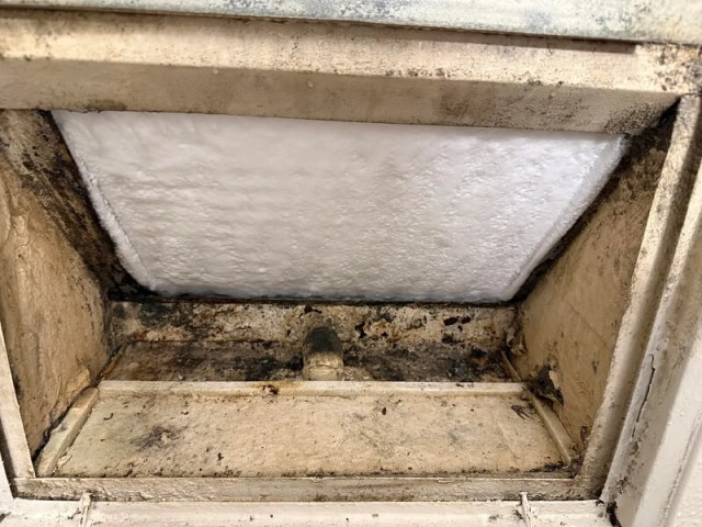 The inside of a wall AC unit.