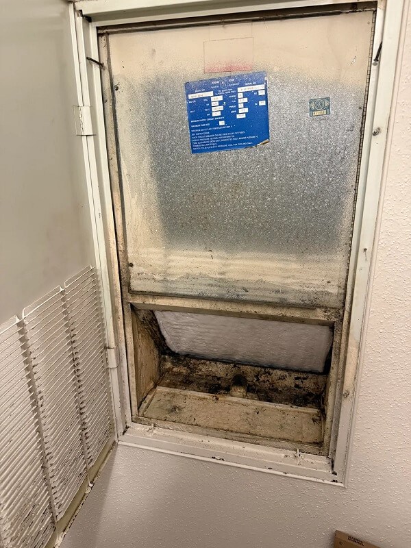 The inside of a wall AC unit.