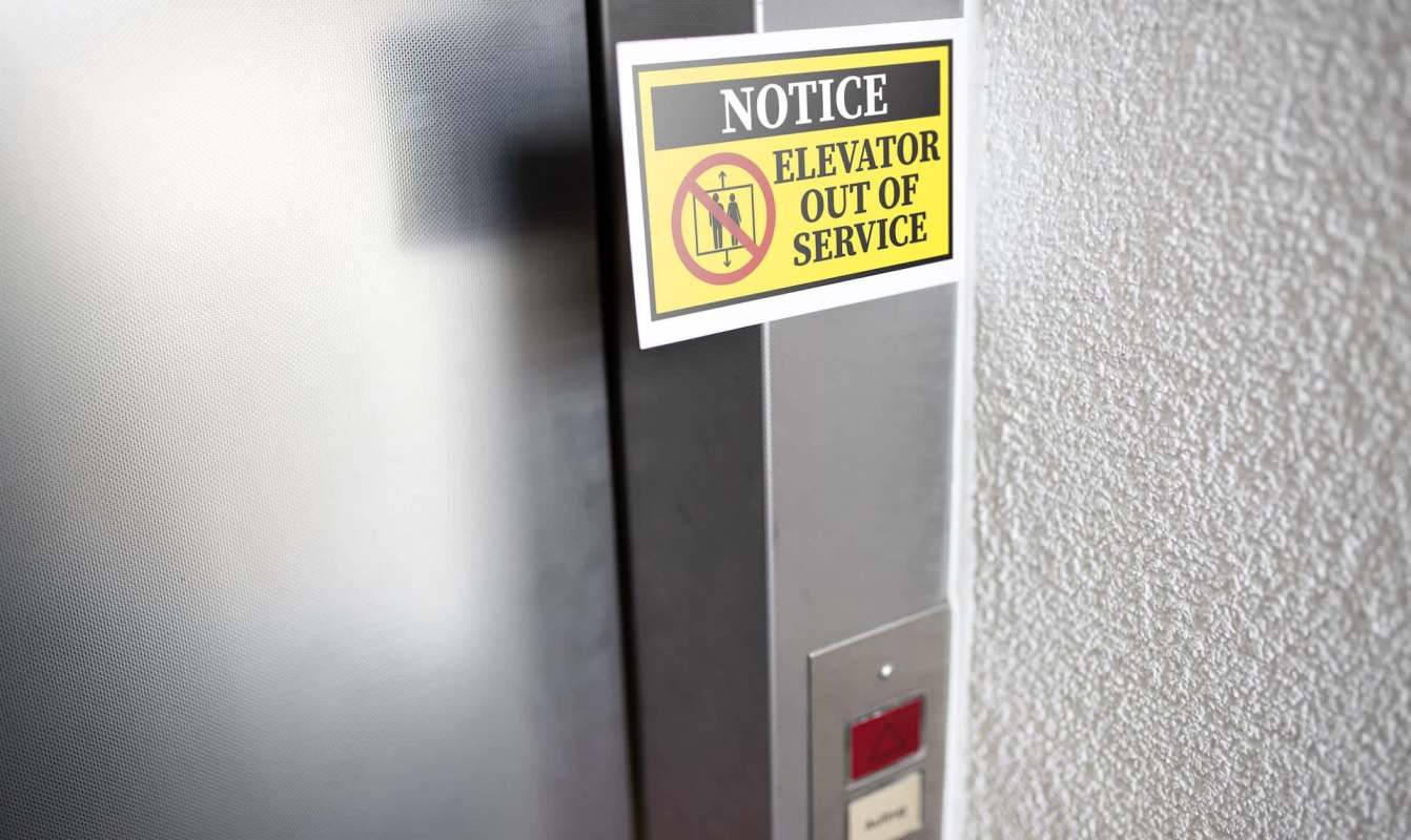 A notice sign indicating the elevator is out of service.
