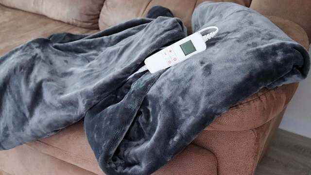 An electric blanket on a couch.