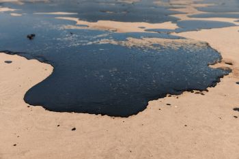 An oil spill on a beach.