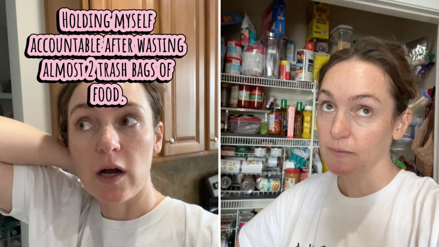 A woman stands in a kitchen, looking at an organized pantry filled with food items.