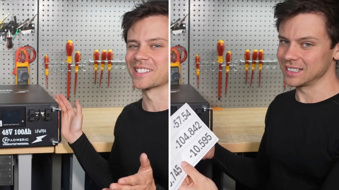 A person standing next to a battery.