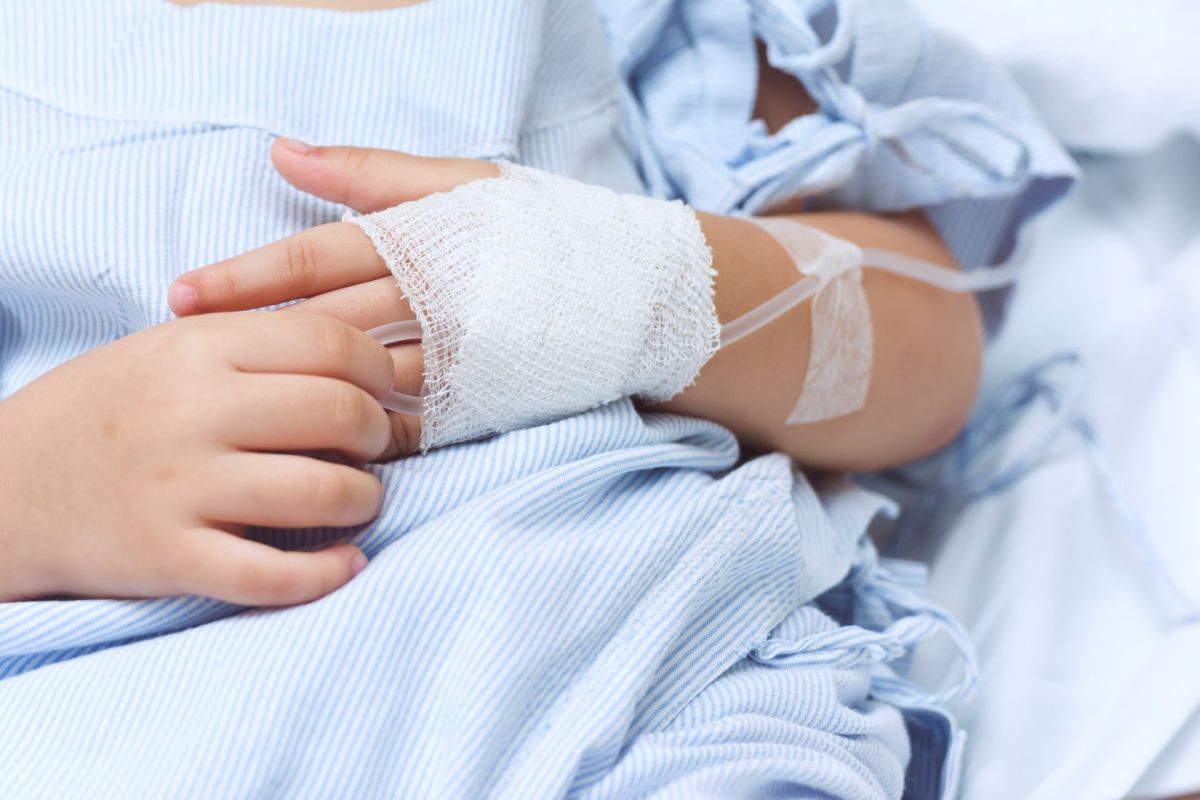 A kid in a hospital bed.