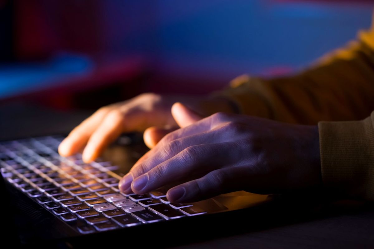 A person typing on a laptop.