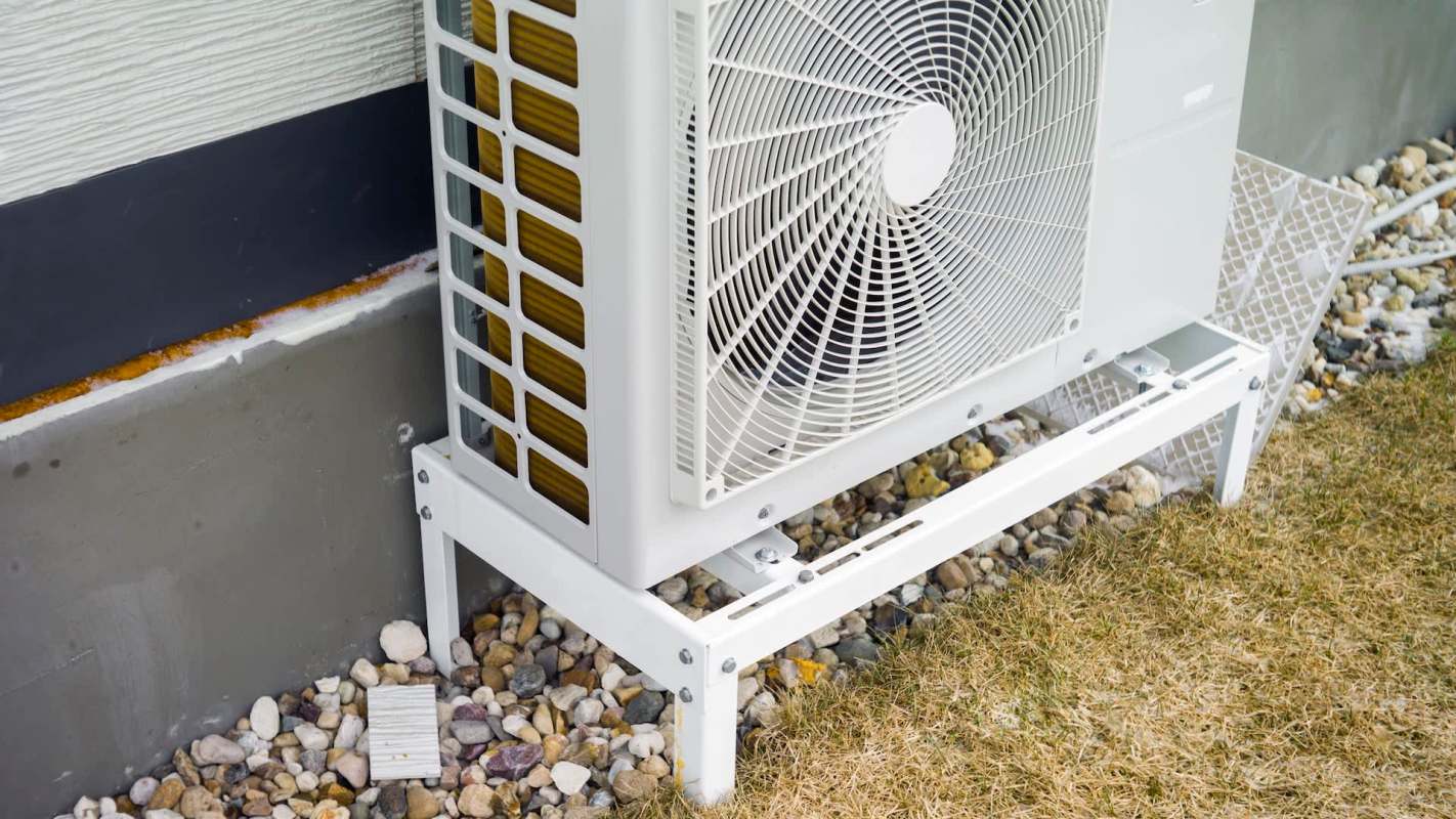 A heat pump alongside a home.