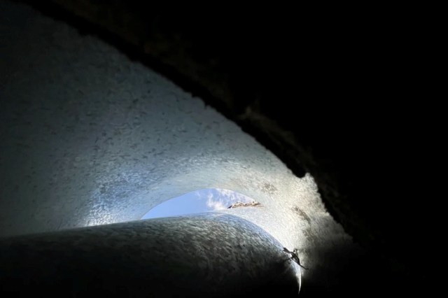 The exhaust pipe from an AC unit.