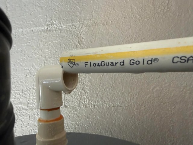 A broken connection on a water heater pipe. 