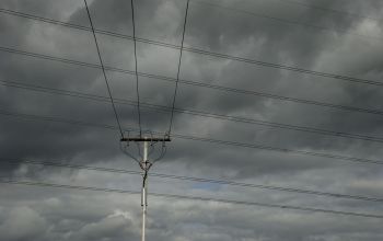 A cloudy sky over power lines.