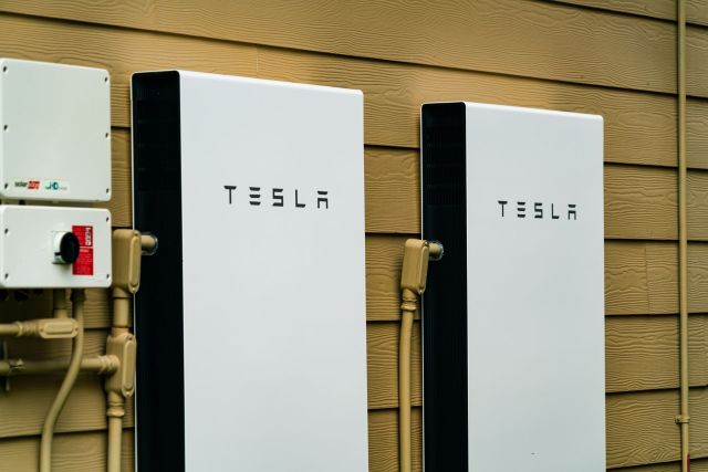 Two Tesla Powerwalls mounted on the wall.