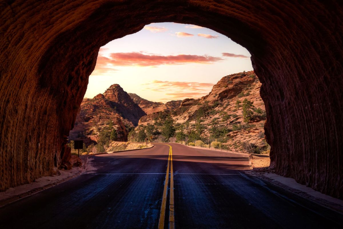A road coming out of a mountain.