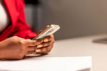 A woman reading on her smartphone.
