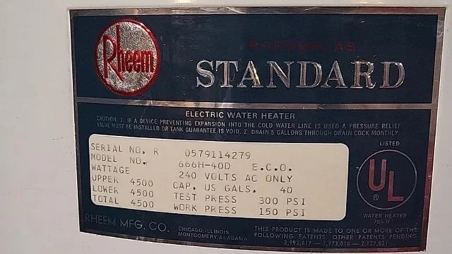 A label on an electric water heater with technical specifications and caution information.