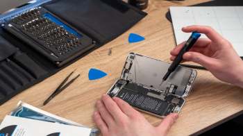 A person repairing a smartphone.