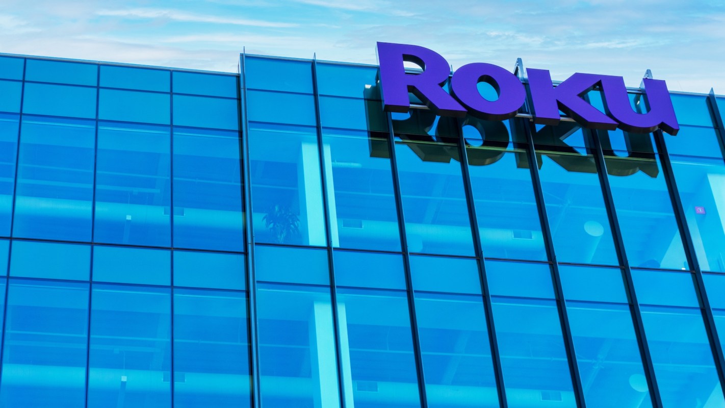 Roku logo displayed on a modern glass building exterior.