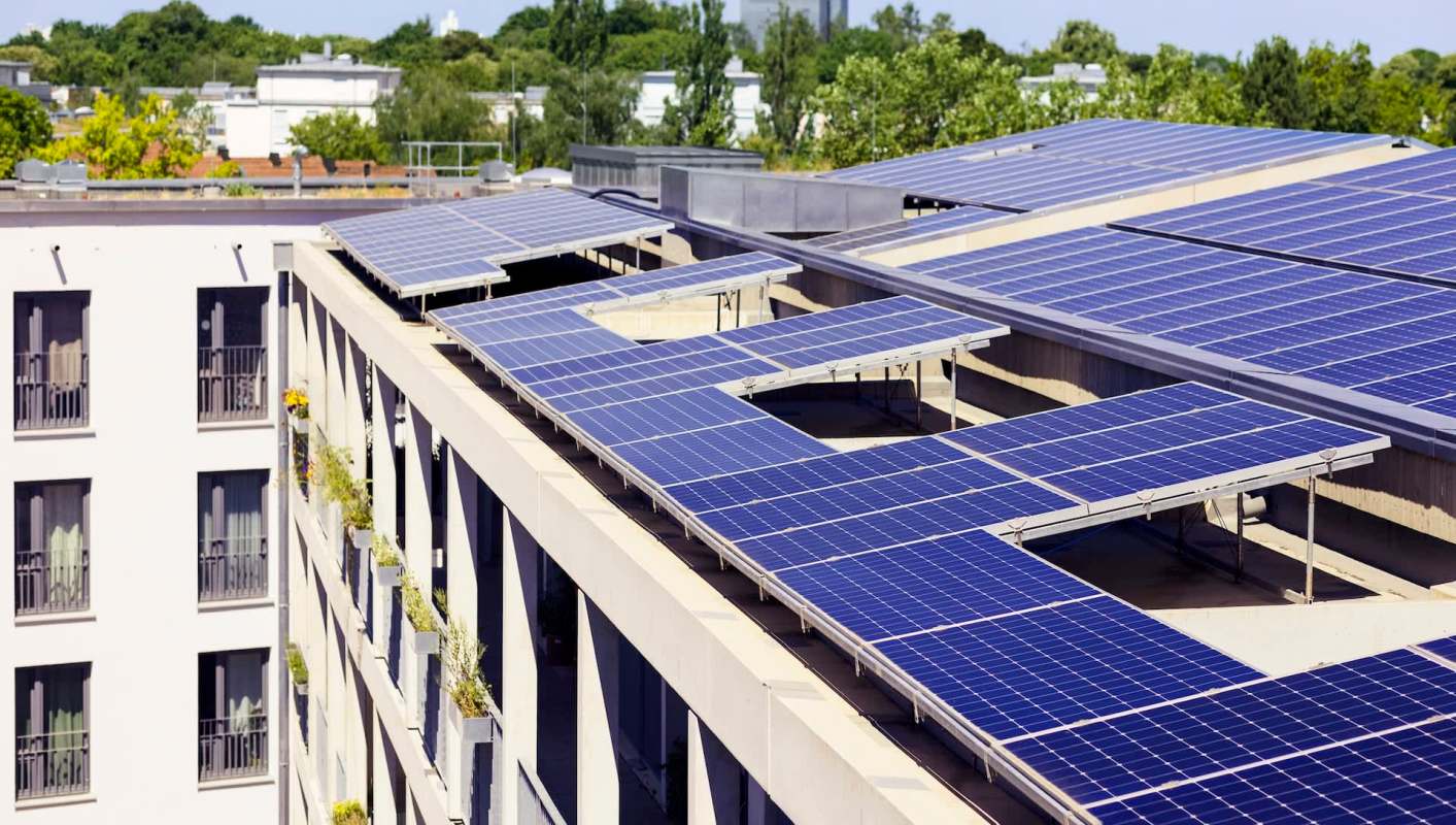 Rooftop solar panels on a multifamily building.