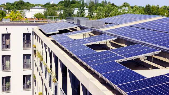 Rooftop solar panels on a multifamily building.