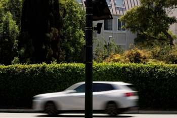 A Flock Safety camera mounted on a pole.